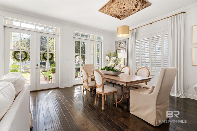 dining room featuring french doors, dark wood-type flooring, and ornamental molding