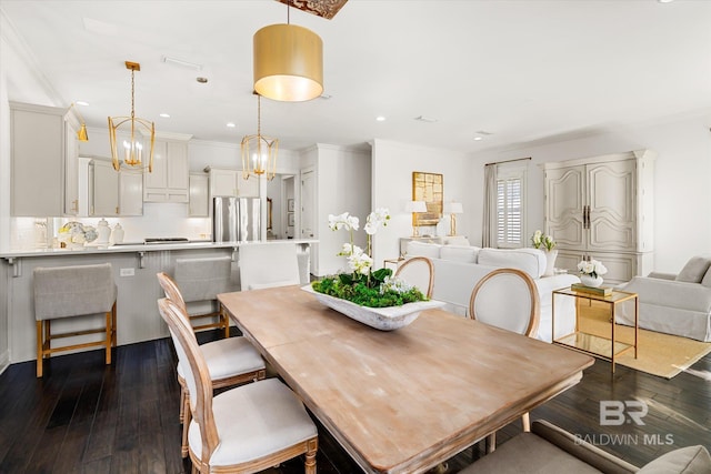 dining area featuring crown molding and dark wood-type flooring