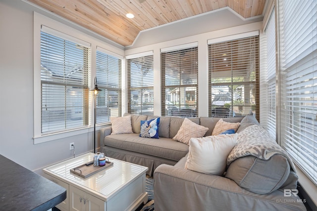 sunroom / solarium featuring wooden ceiling and vaulted ceiling