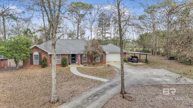 ranch-style home with a carport and a garage