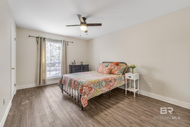 bedroom featuring dark hardwood / wood-style floors and ceiling fan