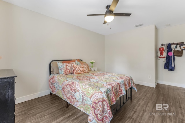 bedroom with dark wood-type flooring and ceiling fan