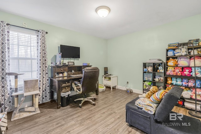 office space with light hardwood / wood-style flooring