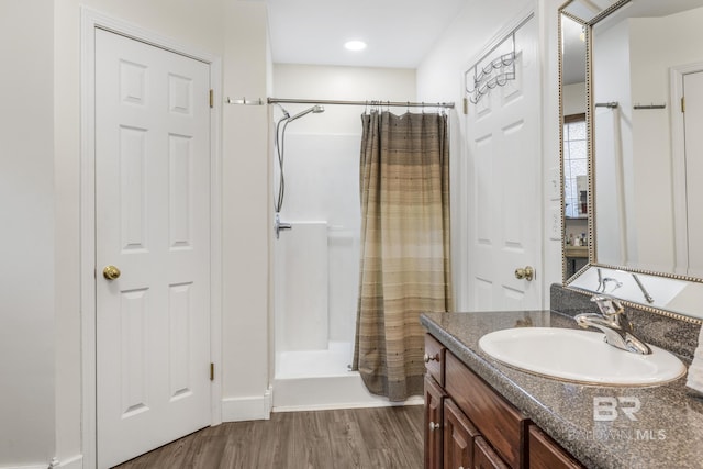 bathroom with vanity, wood-type flooring, and a shower with shower curtain