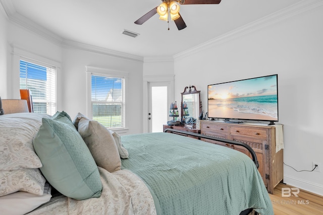 8847 Asphodel Ln, Daphne, AL 36526 - bedroom featuring ornamental molding, light wood-type flooring, a ceiling fan, and baseboards