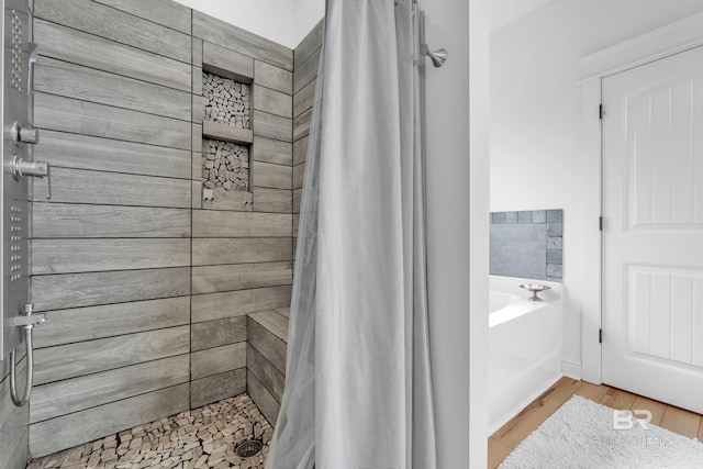 8847 Asphodel Ln, Daphne, AL 36526 - bathroom with a tile shower, a bath, and wood finished floors