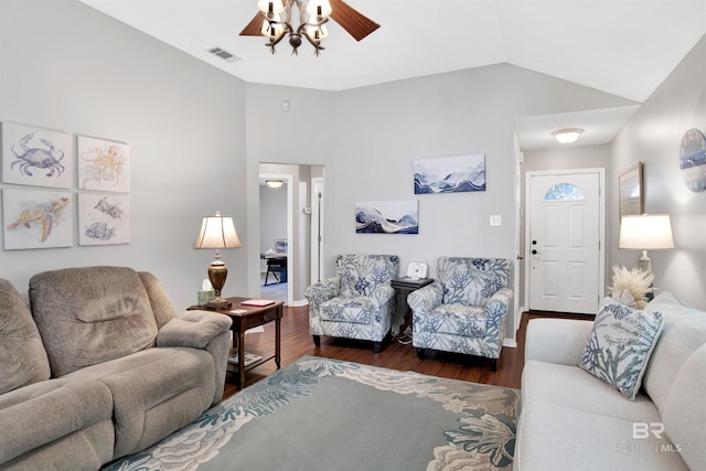 living room with visible vents, wood finished floors, baseboards, lofted ceiling, and ceiling fan