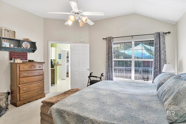 carpeted bedroom with lofted ceiling and ceiling fan