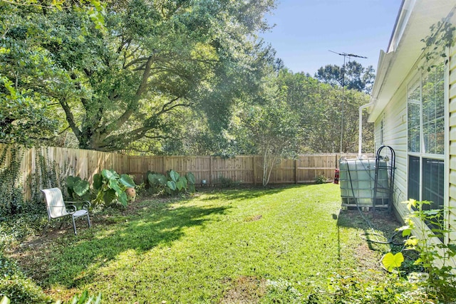 view of yard featuring a fenced backyard