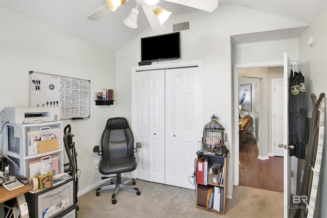 office area with visible vents, lofted ceiling, baseboards, and carpet flooring