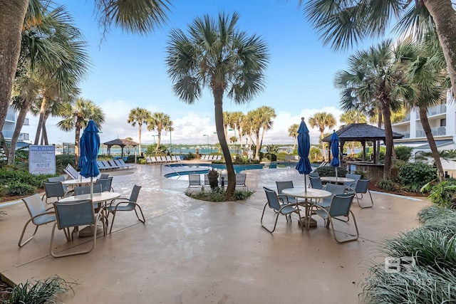 view of patio / terrace with a gazebo and a community pool