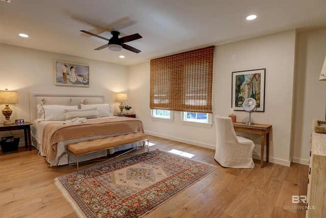 bedroom featuring light wood-type flooring and ceiling fan