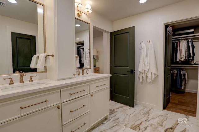 bathroom featuring vanity and hardwood / wood-style flooring