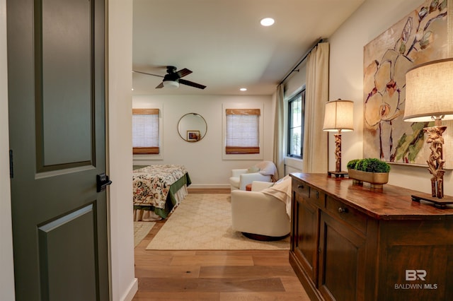 bedroom featuring light wood-type flooring and ceiling fan