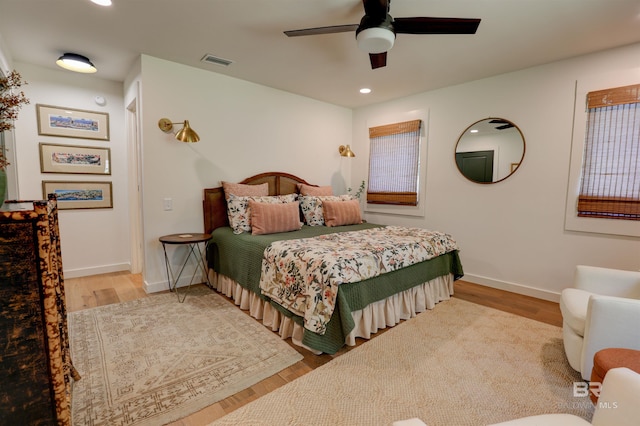 bedroom featuring light hardwood / wood-style flooring and ceiling fan