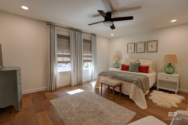 bedroom with dark wood-type flooring and ceiling fan