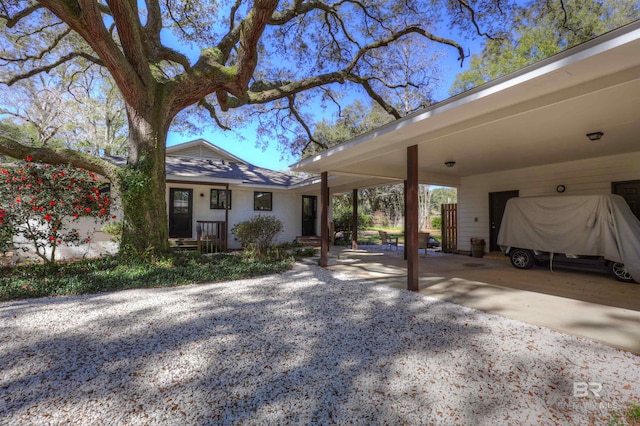 view of front of property featuring a carport