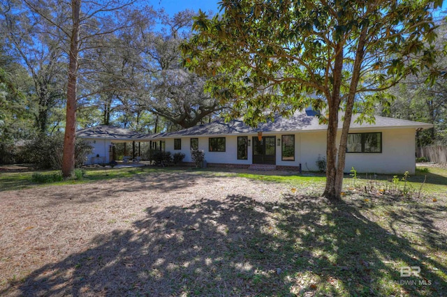 ranch-style house with a front lawn