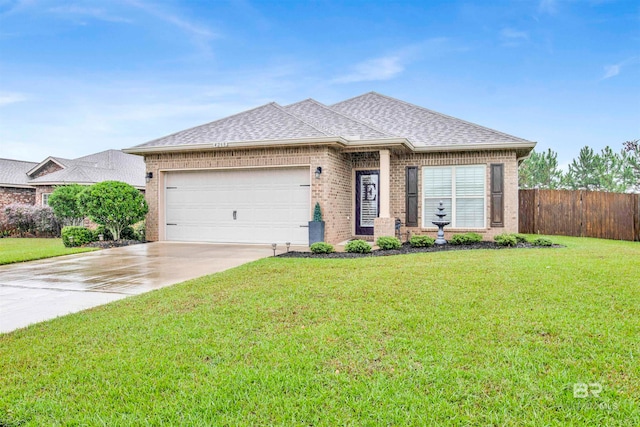 view of front facade with a front yard and a garage