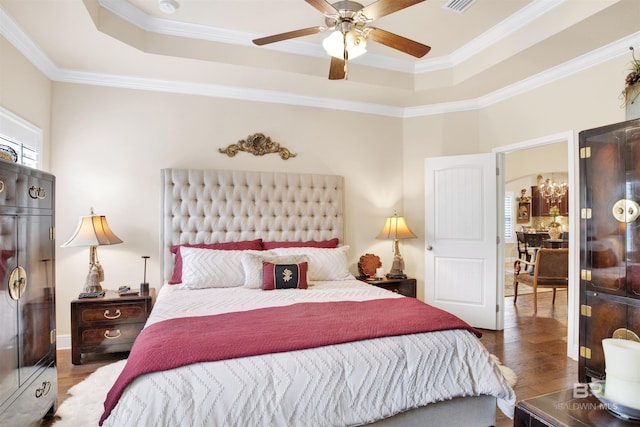 4268 Birkdale St, Gulf Shores, AL 36542 - bedroom featuring a raised ceiling, wood finished floors, crown molding, and ceiling fan