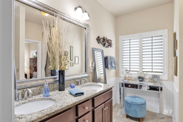 4268 Birkdale St, Gulf Shores, AL 36542 - bathroom featuring a wainscoted wall, double vanity, and tile patterned flooring