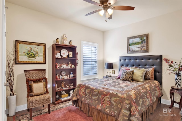 4268 Birkdale St, Gulf Shores, AL 36542 - bedroom with baseboards, wood finished floors, and ceiling fan