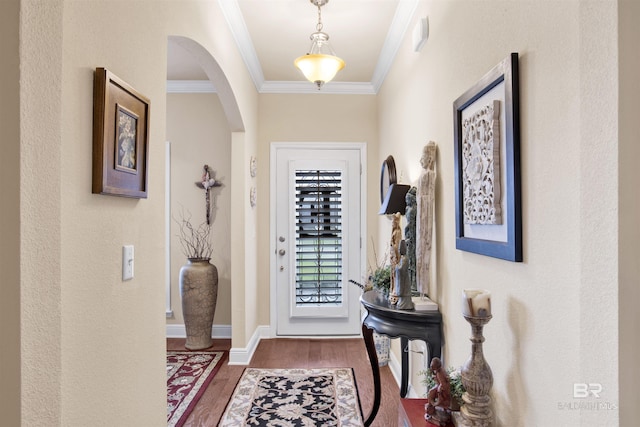 4268 Birkdale St, Gulf Shores, AL 36542 - entryway featuring wood finished floors, ornamental molding, arched walkways, and baseboards