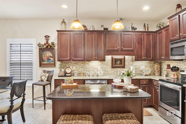 4268 Birkdale St, Gulf Shores, AL 36542 - kitchen with appliances with stainless steel finishes, backsplash, recessed lighting, light tile patterned floors, and decorative light fixtures