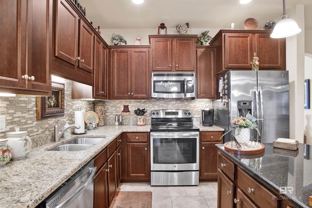 4268 Birkdale St, Gulf Shores, AL 36542 - kitchen with stainless steel appliances, a sink, light stone countertops, and backsplash