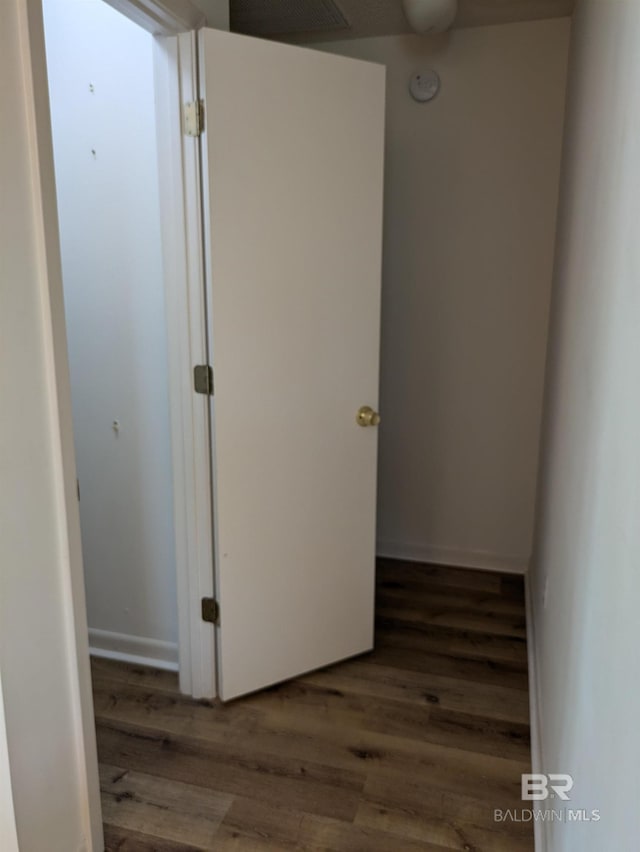 hallway with wood finished floors