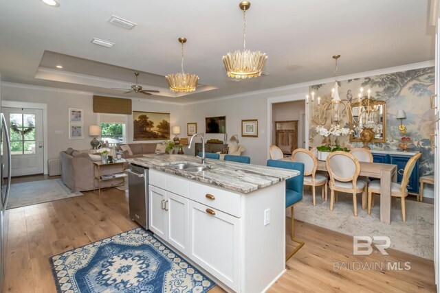 7339 Grissom Dr, Saraland, AL 36571 - kitchen with a chandelier, a sink, a raised ceiling, dishwasher, and open floor plan