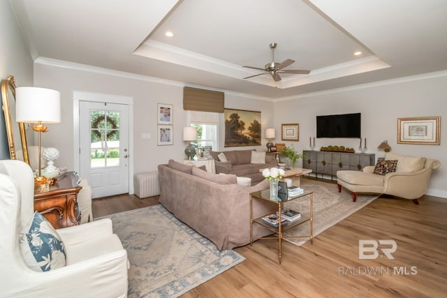 7339 Grissom Dr, Saraland, AL 36571 - living area featuring ceiling fan, light wood-style flooring, a raised ceiling, ornamental molding, and recessed lighting