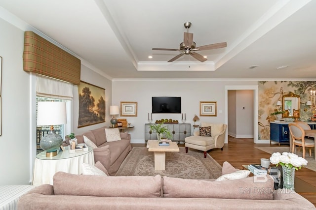 7339 Grissom Dr, Saraland, AL 36571 - living area featuring wood finished floors, a ceiling fan, a raised ceiling, and baseboards