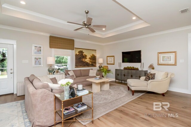 7339 Grissom Dr, Saraland, AL 36571 - living room with a raised ceiling, a ceiling fan, wood finished floors, recessed lighting, and ornamental molding