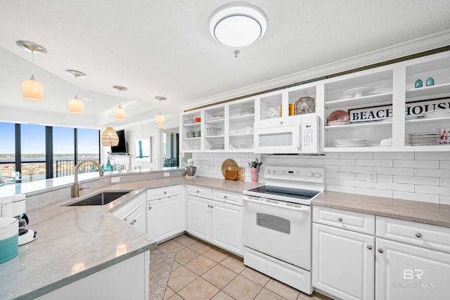 kitchen featuring white appliances, white cabinets, sink, tasteful backsplash, and decorative light fixtures