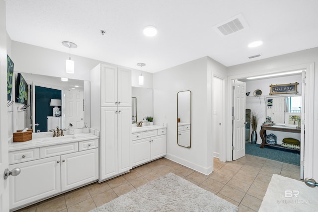 bathroom with tile patterned flooring and vanity