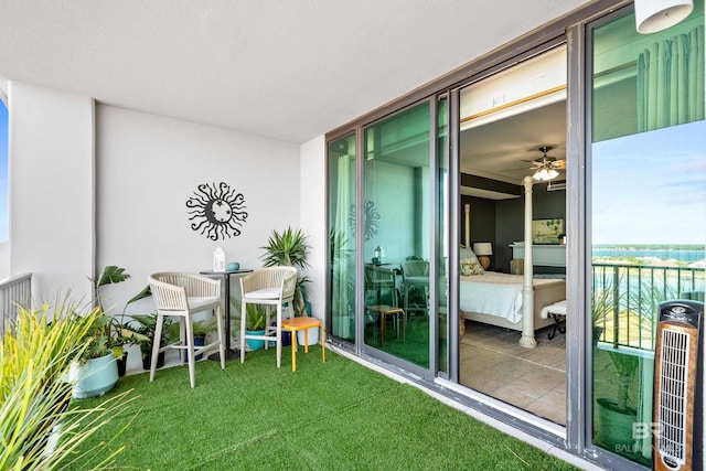 balcony with a water view and heating unit