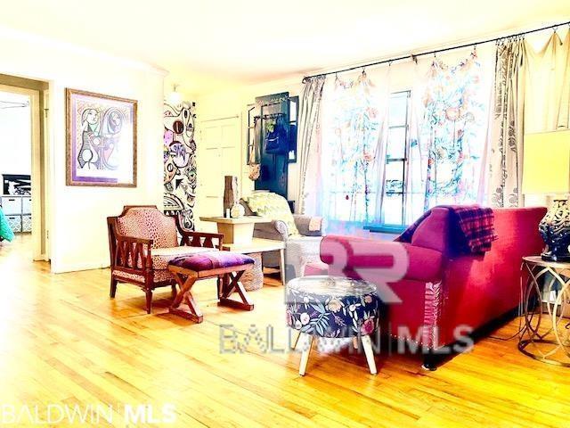 sitting room featuring hardwood / wood-style flooring