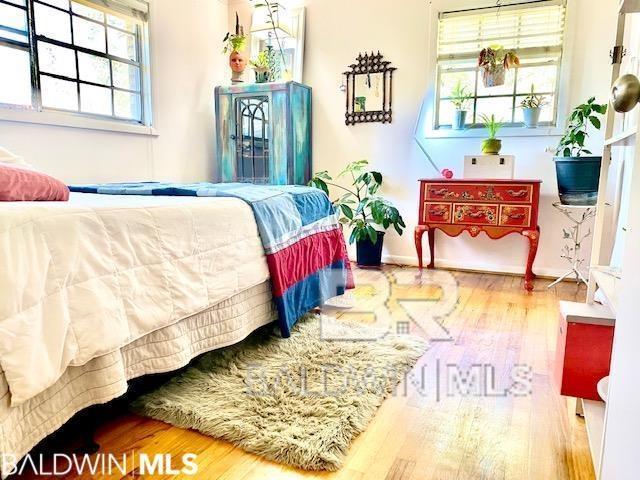 bedroom with wood-type flooring