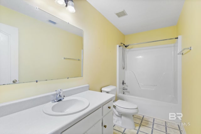 full bathroom featuring vanity, bathing tub / shower combination, toilet, and tile patterned floors