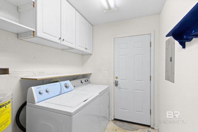 washroom featuring electric panel, cabinets, separate washer and dryer, water heater, and a textured ceiling