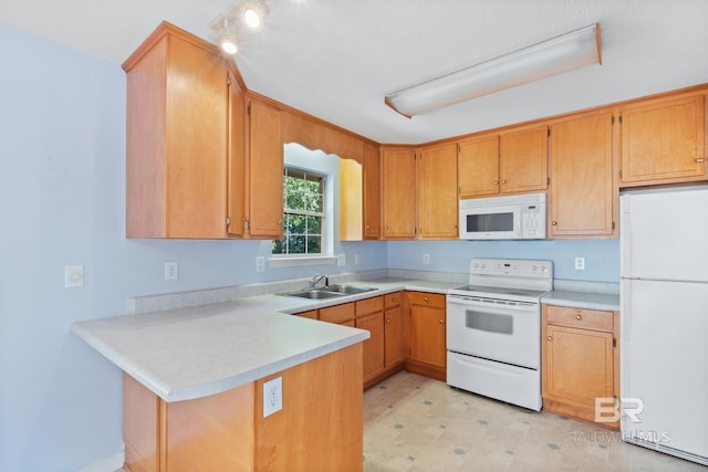 kitchen featuring kitchen peninsula, white appliances, sink, and a textured ceiling