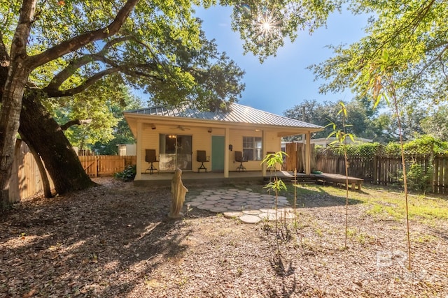 back of house with a patio area