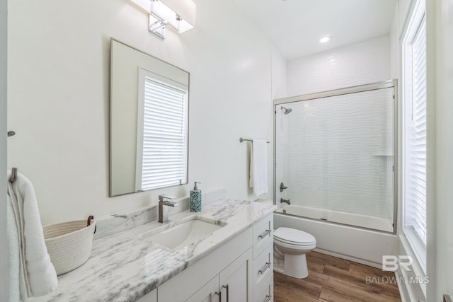 1050 W Beach Blvd Unit E, Gulf Shores, AL 36542 - full bathroom featuring vanity, wood finished floors, and enclosed tub / shower combo