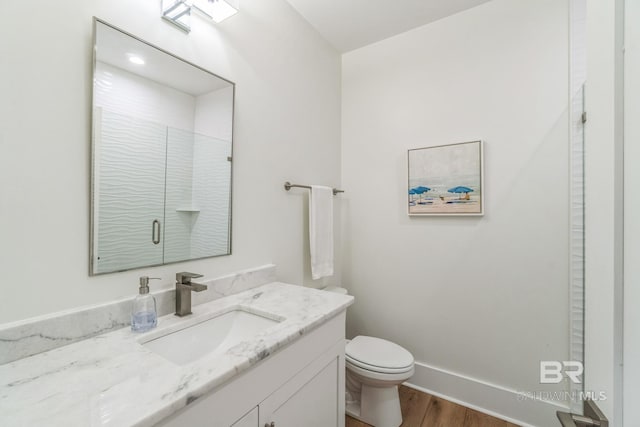 1050 W Beach Blvd Unit E, Gulf Shores, AL 36542 - full bath with vanity, wood finished floors, and a shower with shower door