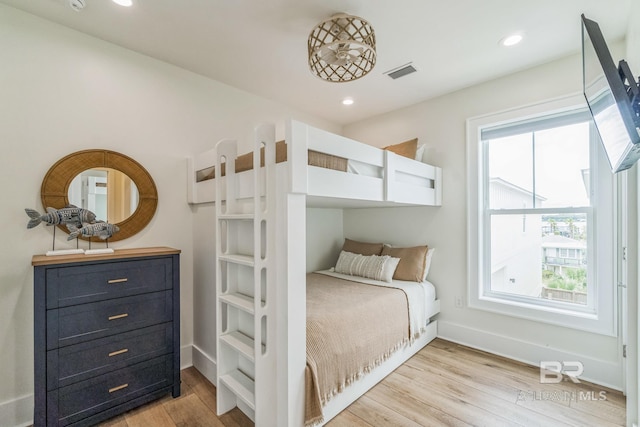 1050 W Beach Blvd Unit E, Gulf Shores, AL 36542 - bedroom with light wood-style floors and recessed lighting