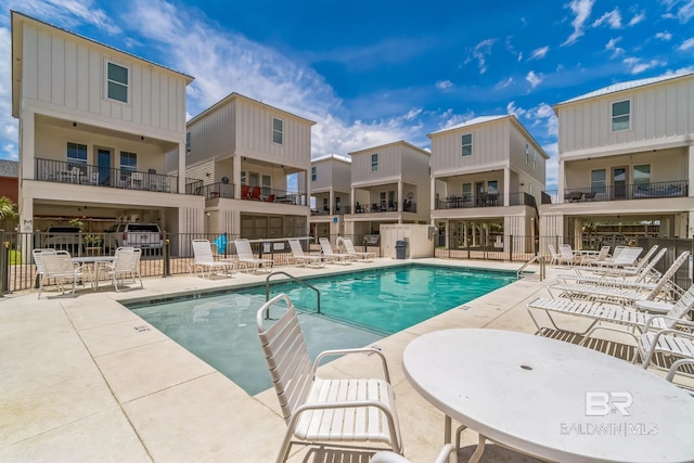 1050 W Beach Blvd Unit E, Gulf Shores, AL 36542 - community pool featuring a patio area