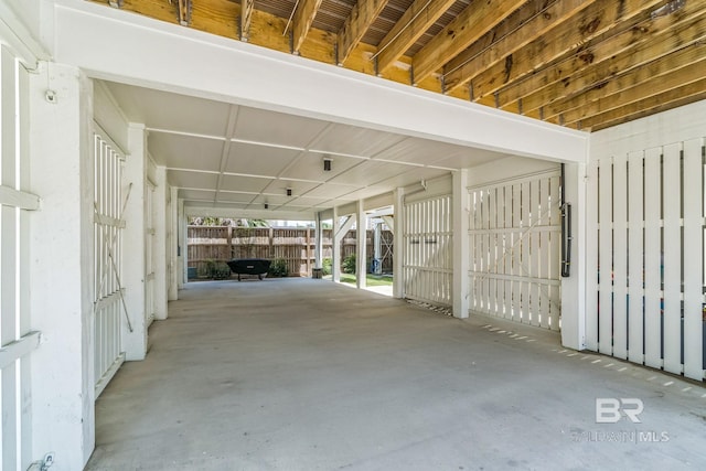 1050 W Beach Blvd Unit E, Gulf Shores, AL 36542 - garage featuring a carport