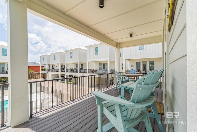 1050 W Beach Blvd Unit E, Gulf Shores, AL 36542 - wooden terrace featuring a residential view