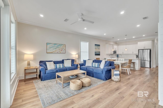 1050 W Beach Blvd Unit E, Gulf Shores, AL 36542 - living room with crown molding, light wood-type flooring, ceiling fan, and recessed lighting